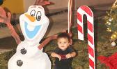 Child laughing as he sees the cartoon character Olaf