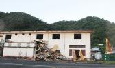 Old ASTCA building in Fagatogo with debris from demolition