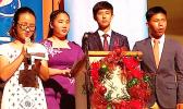 Pictured is Katherine Kim (on the mic) and three of her peers: Michelle Lo, Heyao Yang, and Victor Chen. 
