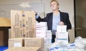 Official with vaccine kits