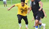 A Pago Youth player (left) and Tafuna Jets opponent 