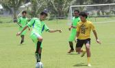 A Taputimu Youth player tries to control the ball 