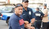 Defendant, Pati Lepou with a police officer 