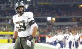 Oregon offensive lineman Penei Sewell (58) looks on as Oregon plays Auburn in an NCAA college football game Saturday, Aug. 31, 2019, in Arlington, Texas. (AP Photo/Ron Jenkins) Oregon offensive lineman Penei Sewell