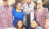 Pfc. Washington Pou Ameperosa stands for a picture with three sisters and his grandparents 