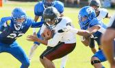 Tafuna Warriors Puletu Fono bracing for impact as he is moments away from being ‘sandwiched’ by two Shark defenders in the first half of their varsity play-off game. Fono recorded two touchdown catches as he led the Warriors to a 14 - 6 victory. [photo: TG]