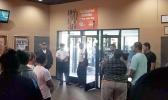 Police standing by the front door as movie goers file out of the Theatre