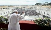 Pope Francis waves to an estimated 70,000 people gathered in St. Peter's Square at the Vatican for his Christmas blessing "urbi et orbi" (to the city and the world) Dec. 25, 2023. (CNS photo/Vatican Media) Pope Francis waves to an estimated 70,000 people