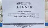 Sign at Post Office saying closed for National Day of Mourning 