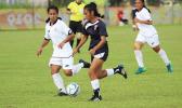 Precious Ieremia of American Samoa dribbles away