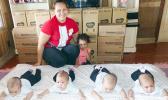 Maureen 12-pounds, Mariya 10-pounds, Melisha 12-pounds and Miracle 11-pounds with their mother and older sister