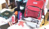 Pictured are some of the items being distributed by the American Red Cross to families whose homes were aff ected by Tropical Storm Gita last month. Th e care kits include necessities such as fl ashlights, batteries, fi rst aid kit, tarp, burner, and a cooler. [photo: THA]
