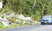 Mangled roofing iron from houses was a familiar sight on the side of the road after Tropical Storm Gita swept through the territory this past weekend. Up to 80+ mph gusts of winds took down not just trees and roofs of houses, but also telephone and electric poles adding to the devastation.  [photo: TG]