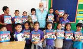 Rotary Club of Pago Pago vice president, Peter Tinitali presented dictionaries to the 3rd graders of Siliaga Elementary School.