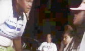 This photo is a screenshot from the video, showing head coach Annie Coffin - who is also a DPS police officer - addressing one of her players, only seconds before she allegedly put her hands on her.