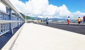 People out exercising on the new Vaisigano bridge, prior to its opening on Aug. 11. People out exercising on the new Vaisigano bridge