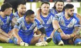 The Boys keep a stiff upper lip after their loss at the Rugby League World Cup final match between Australia and Samoa at the Old Trafford Stadium in Manchester, England, Saturday, Nov. 19, 2022. (AP Photo/Rui Vieira) Toa Samoa players
