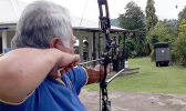 Samoan Prime Minister Tuilaepa Aiono Sailele Malielegaoi aiming to shoot an arrow