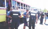 Catholic Education director, Father Mikaele Tuimavave, has appealed to students to stop the violence. (Photo: Supplied) Police talking to students near school bus.
