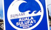 A sign directs people to the tsunami escape route on Samoa's Lalomanu Beach.