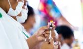  Nurse April Wilson (L) and team leader Luisa Popo preparing vaccinations