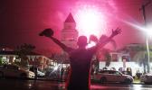 Man watching fireworks light up the sky in Apia on New Year's 2022