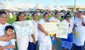 women with signs supporting an additional slot for women in parliament