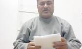 Samoa sailor, Puletiu  holds up a paper from his employer