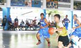 Marist Crusaders with a fast break, while Samoana Sharks try to chase them down, last Saturday morning at the Samoana High School Gymnasium in Utulei.  [photo: Ese Malala]