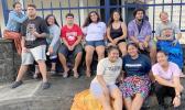 Some Samoana high school seniors waiting to take part in their photo shoot outside the Lee Auditorium.
