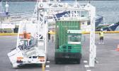 A container trailer truck goes through the M60 container scanner equipment around 7a.m. on Monday, Apr. 3, when the scanner operation as well as the scanner fee, went into effect, at the main dock of the Port of Pago Pago. Customs officials says some 30-plus containers were scanned on Monday. [photo: Fili Sagapolutele]