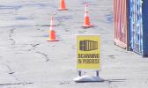 This Customs Division “SCANNING IN PROGRESS” sign was seen placed by a Customs agent just off the entrance to the Port of Pago Pago, before two container hauling trucks entered the main dock and went through the container scanner equipment around 2:30 p.m last Friday.  [photo: FS]