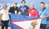 Micah with medal and others