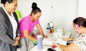 Katie Leilua and Tasi Miller cheer on Ala Poasa as she tries for the first time to put the pedal to the needle and create some stitches on her material. Katie Leilua and Tasi Miller cheer on Ala Poasa