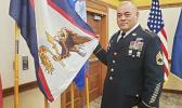  SFC Samasoni Lele’a with the American Samoa flag