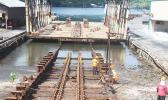 Ronald Reagan Shipyard employees working on repairs to the front portion of the 3,000-ton slipway at Satala yesterday morning. 