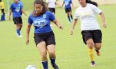 Samoana Sharks’ Deidra Steffany (left) defends against Fa’asao-Marist Cougars’ Lourdes Afoa