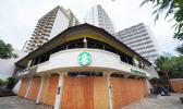 A Waikiki Starbucks coffee shop near Kapahulu Avenue with windows boarded up