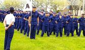 In this photo from the U.S. Coast Guard Family Facebook page. Alaimaleata is leading the whole unit (front) holding the flag.  [courtesy photo]