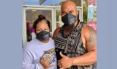 Isaac and Mrs Sopoaga with protective masks on