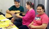 Special needs kids with a parent enjoying making music.