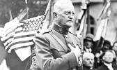 In this Sept. 15, 1935, file photo, General John J. Pershing makes a speech during the ceremony of planting an oak tree named after him to celebrate his 75th birthday and the 17th anniversary of the battle of St Mihiel, in St Mihiel, France. In the aftermath of World War I, 14 countries competed in the Inter-Allied Games in 1919, in a stadium named for Pershing, commander of the American Expeditionary Force in Europe. (AP Photo/File) General John J. Pershing