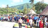 In the sweltering heat, hundreds of employees from StarKist Samoa and Talofa Systems were at the Suigaula ole Atuvasa Beach Park this past Saturday to pick up their care packages and other items donated by "Love Thy Neighbor" and other local businesses. [photo: courtesy]