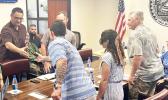 Talauega shakes hands with Army Corps officials