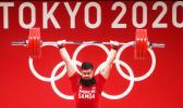 Tanumafili Malietoa Jungblut in front of Olympic logo lifting