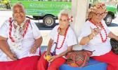 Three senior citizens at bus stop 