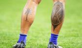 Tattoos on legs of rugby player