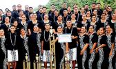 the Samoana Sharks — pictured with their choir director, Pati Pati (left) and school principal Rod Atafua (right)