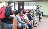 Tax filers wait for their turn at the Tax Office