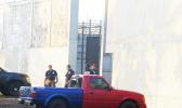 TCF guards changing shifts outside wall